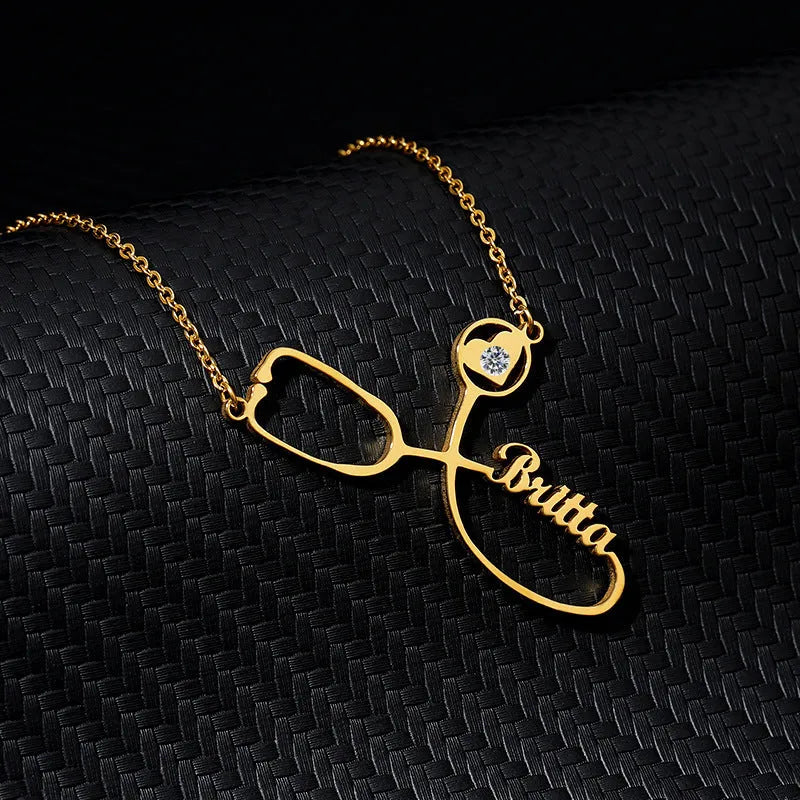 Customised titanium steel stethoscope name necklace for women in gold finish with blade chain