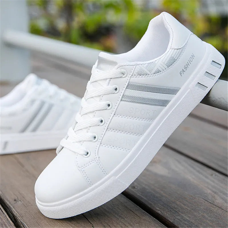 Black, grey, and white sports shoes on a size chart showing EU sizes 39 to 44 with foot length measurements.