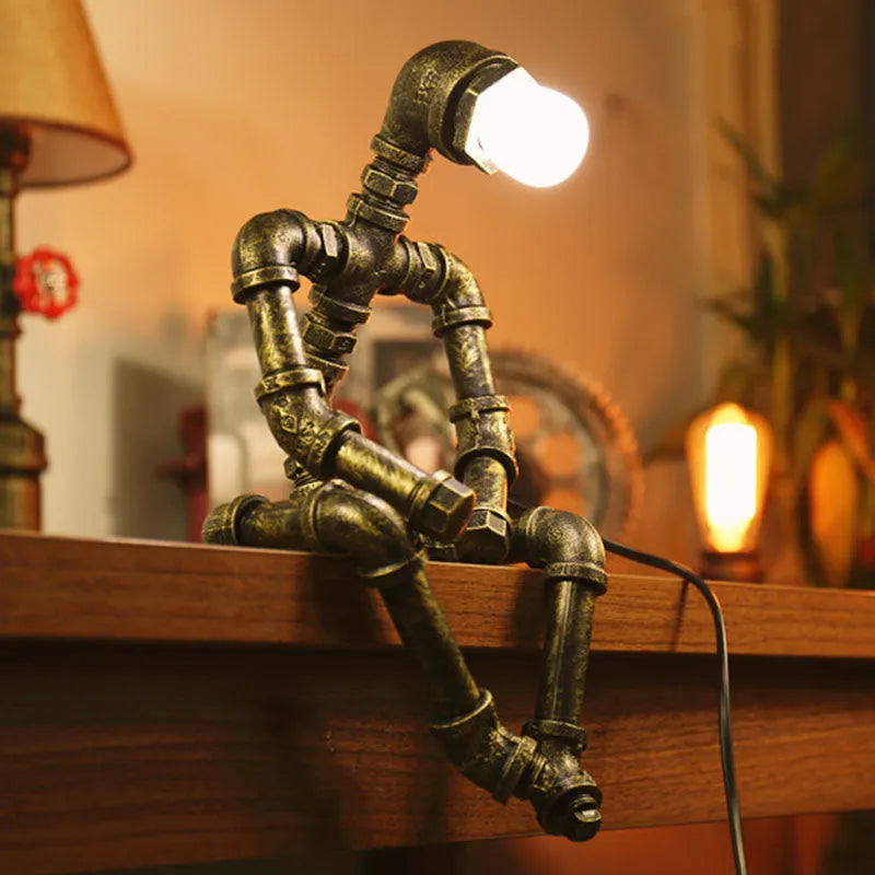 Robot vintage industrial table lamp with iron pipe construction in green bronze finish
