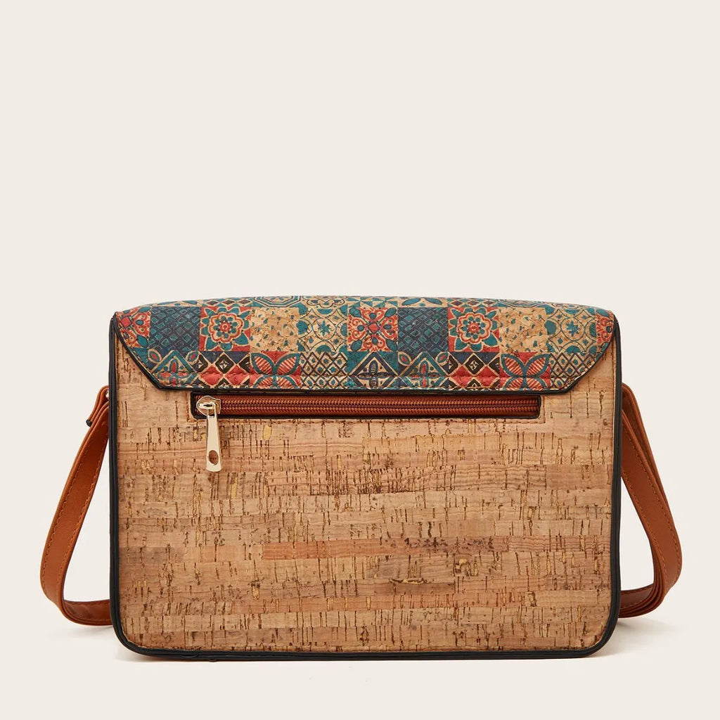 Women's large crossbody bag in a printed PU material with a single shoulder strap.