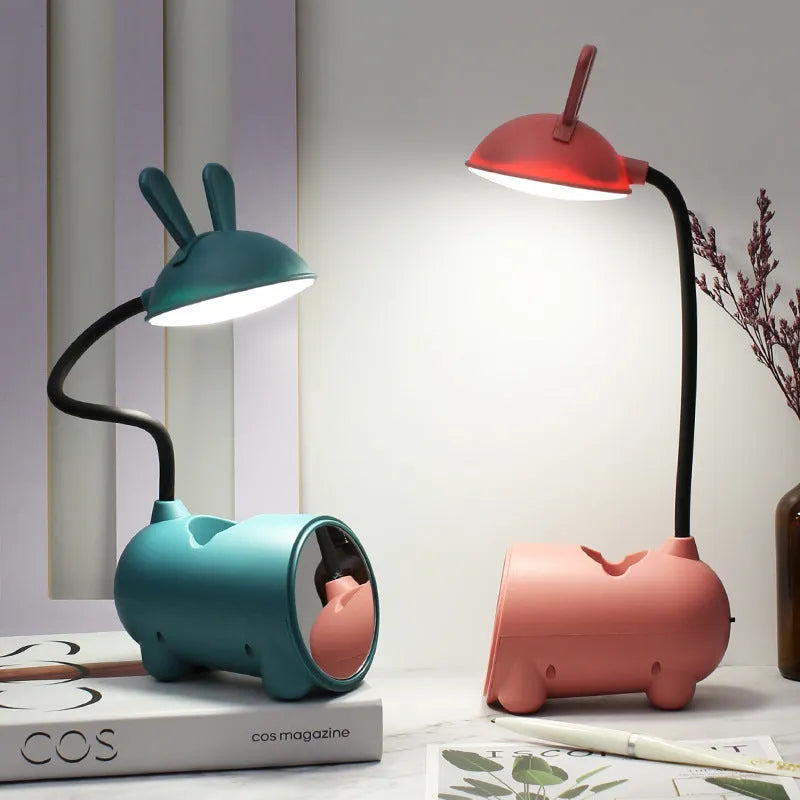 Cartoon-style USB table lamp with pen storage compartment in green colour