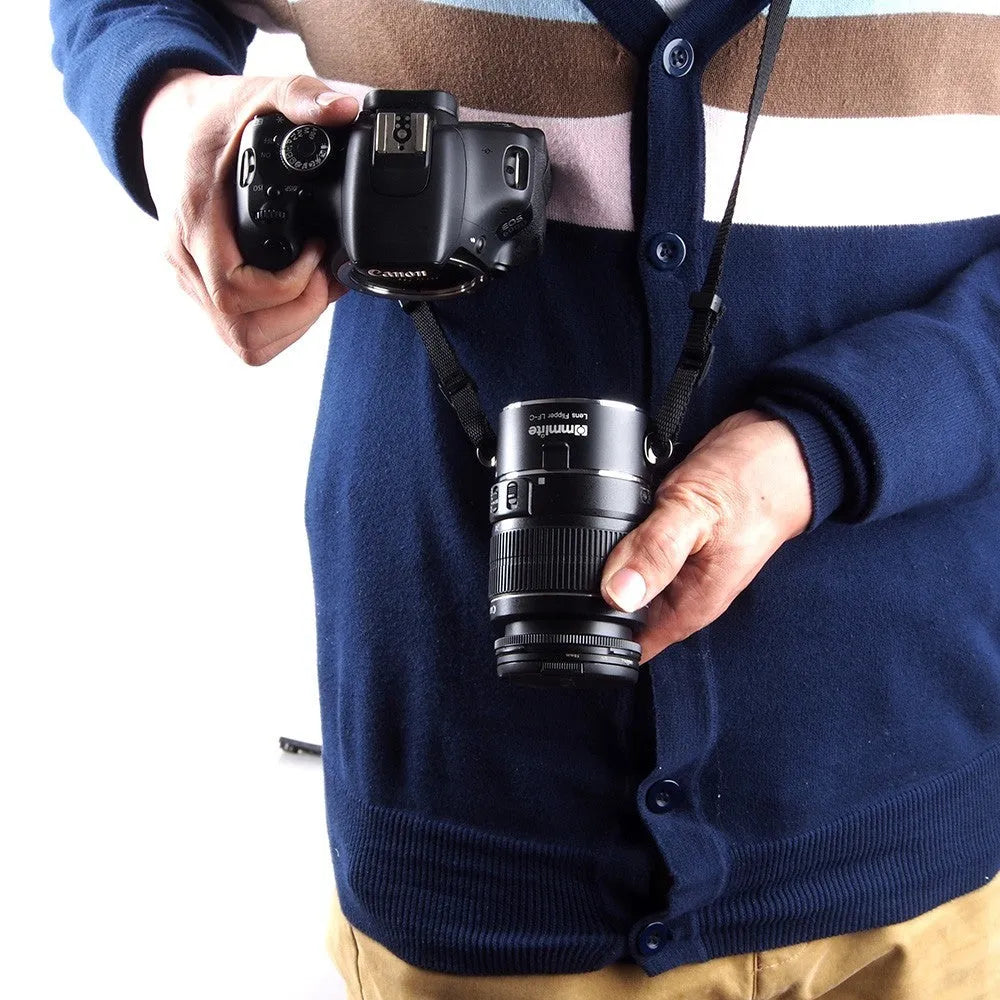 Aluminium camera lens flipper holder for Nikon with cotton shoulder strap.