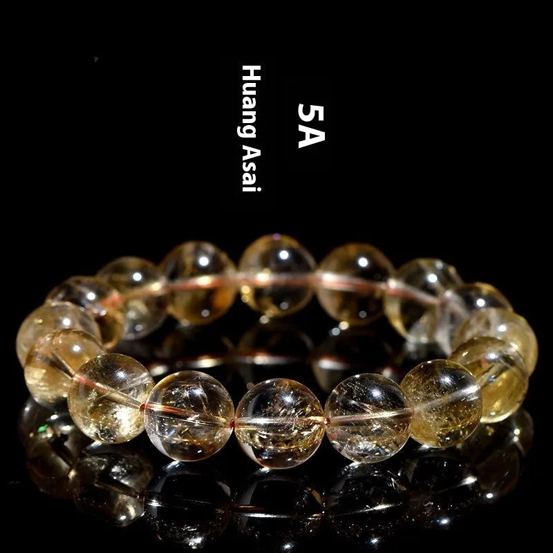 Natural yellow citrine gemstone bracelet showing single circle and three circle bead designs on a wrist.