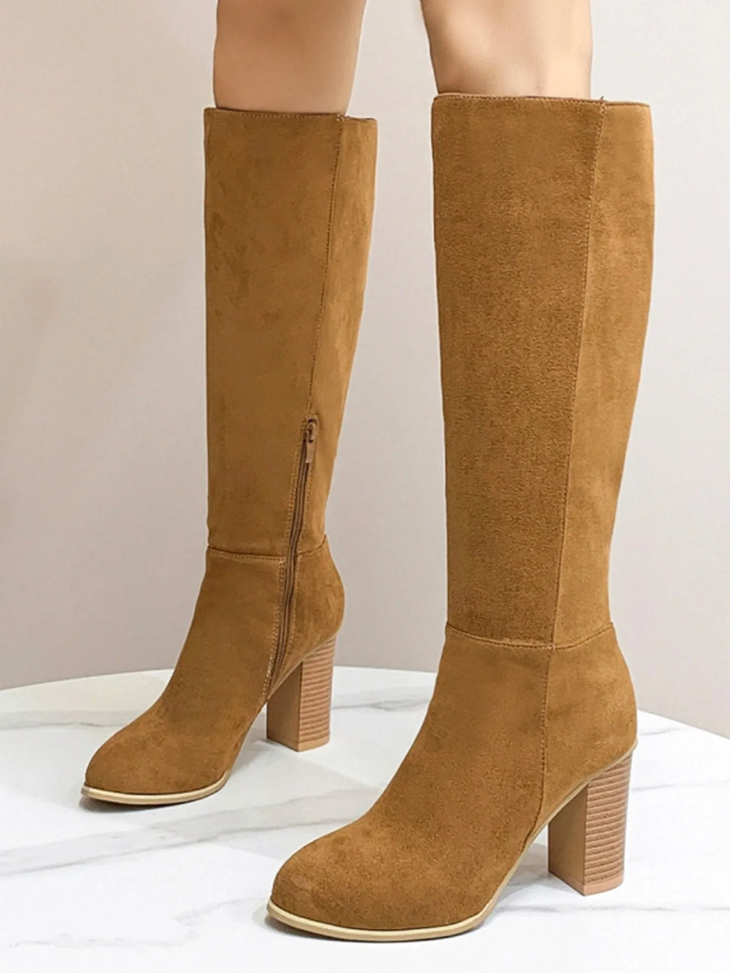 Women's black square toe high heel fashion boot made of synthetic PU.