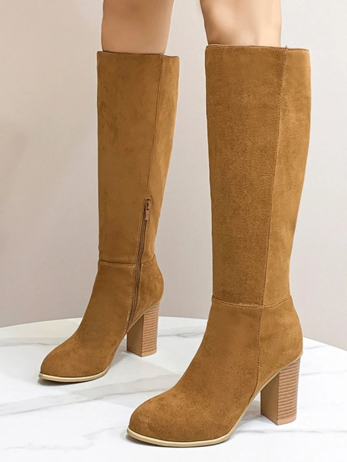 Women's black square toe high heel fashion boot made of synthetic PU.