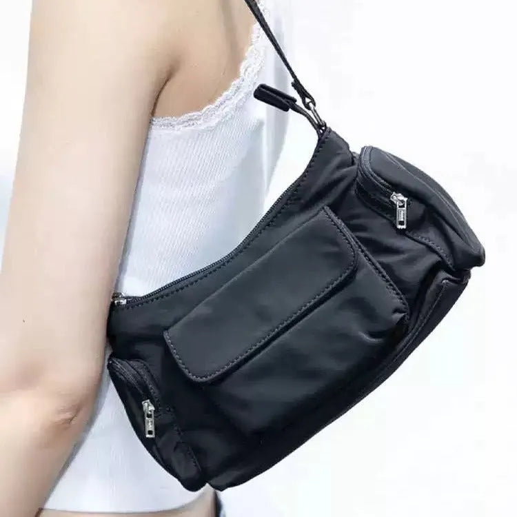 Black lightweight women's shoulder bag with double pockets and a side line design.
