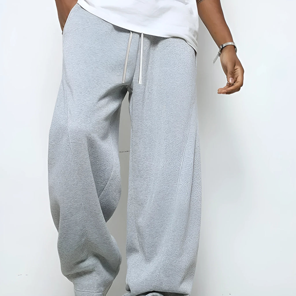 Men's straight-leg casual trousers with elastic waist in black, dark grey, and light grey colours