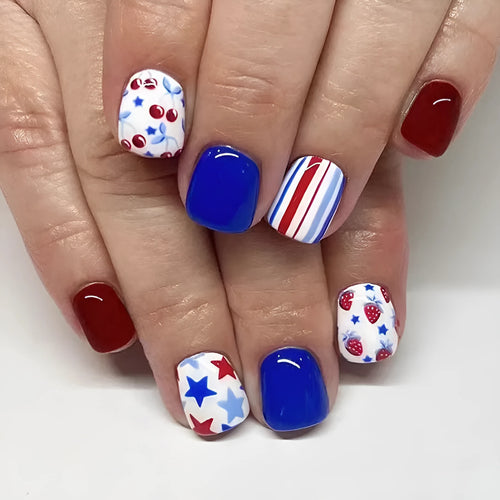 Short glossy false nails with red and blue strawberry and cherry Independence Day design