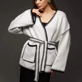 Lace-up front knitted cardigan in imitation cashmere fabric showing loose fitting design and long sleeves