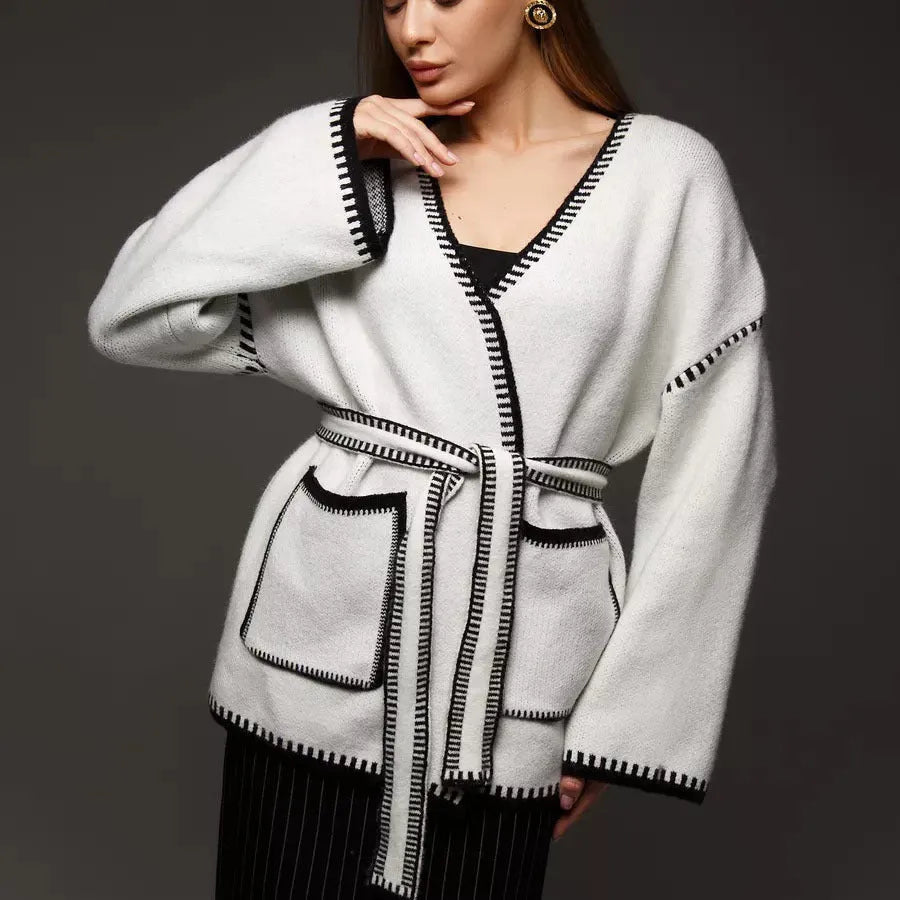 Lace-up front knitted cardigan in imitation cashmere fabric showing loose fitting design and long sleeves