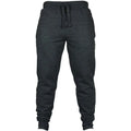 Man wearing solid black loose-fit cotton fleece pants with a drawstring waistband.