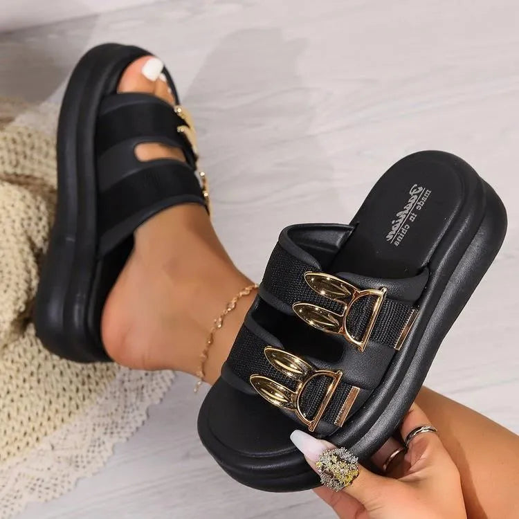 Women's apricot suede slippers with thick rubber sole on wooden floor