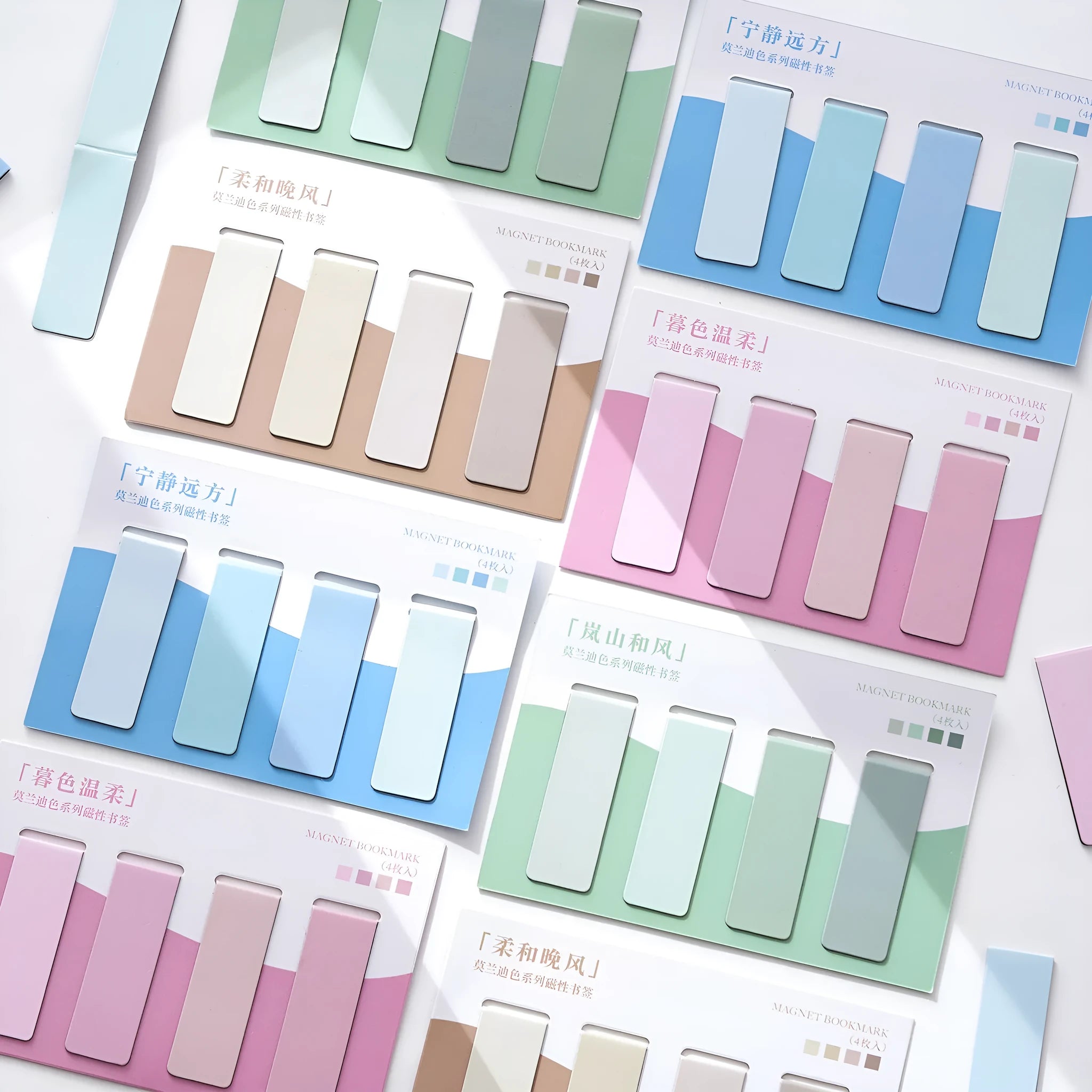 Set of four Morandi Series pastel colour-block magnetic bookmarks on a book page.