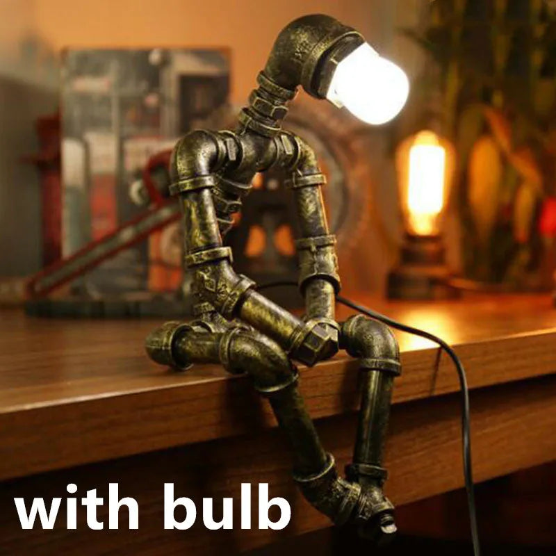 Robot vintage industrial table lamp with iron pipe construction in green bronze finish