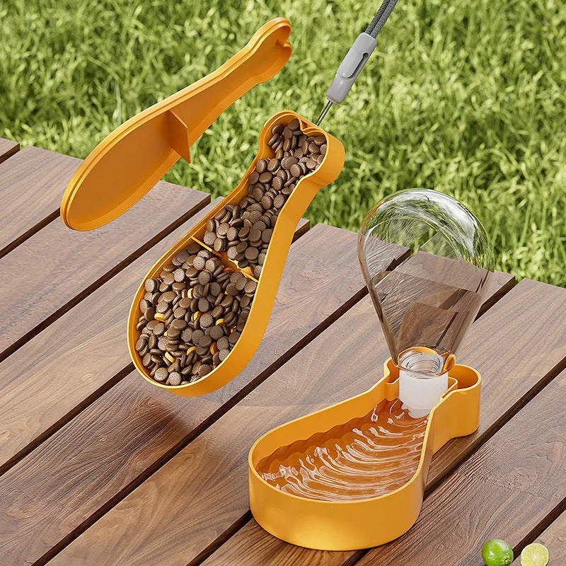Orange and white portable pet water feeder with water bottle and food container for outdoor use