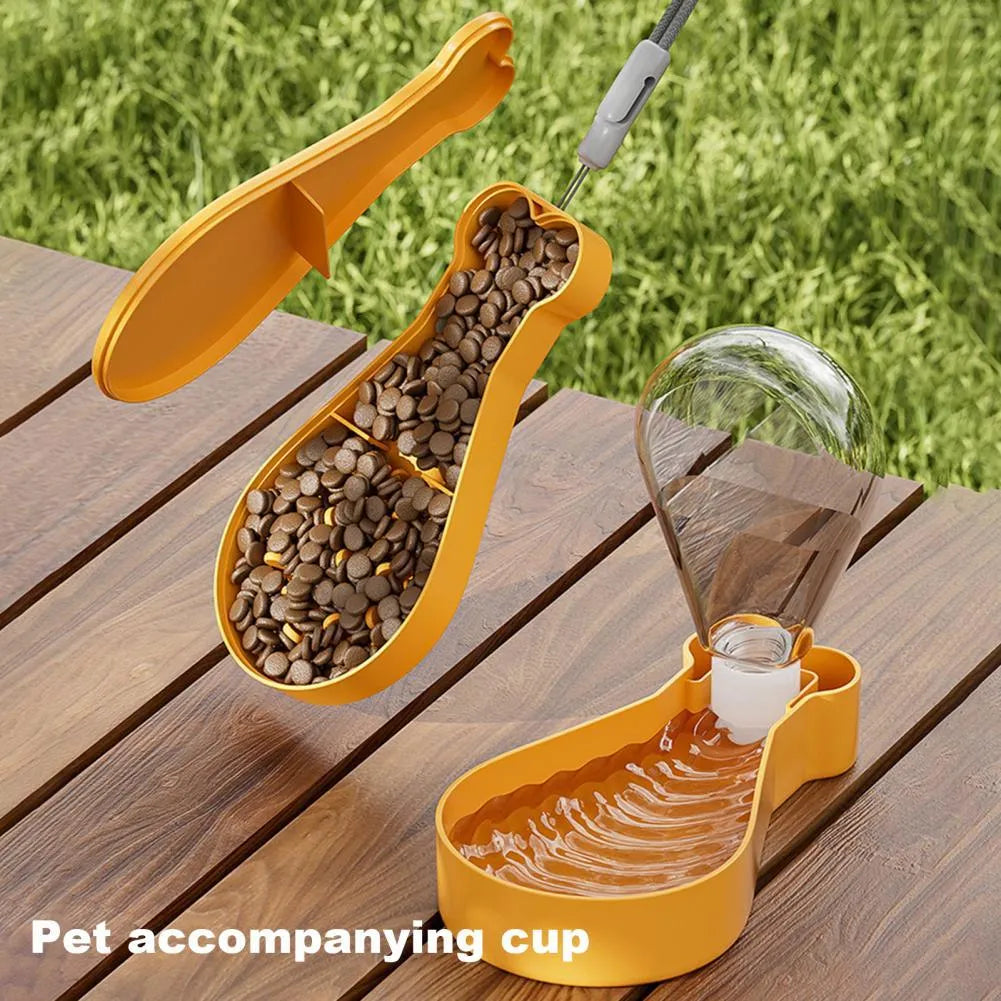 Orange and white portable pet water feeder with water bottle and food container for outdoor use
