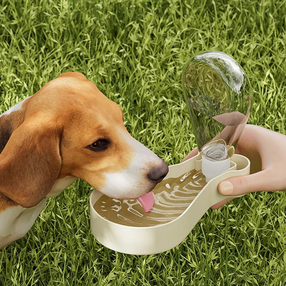Orange and white portable pet water feeder with water bottle and food container for outdoor use