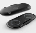 Black and white dual wireless charging pad showing two phones charging simultaneously