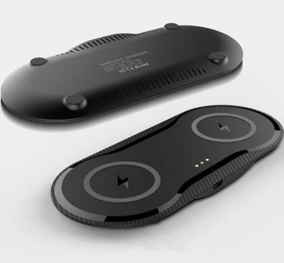 Black and white dual wireless charging pad showing two phones charging simultaneously