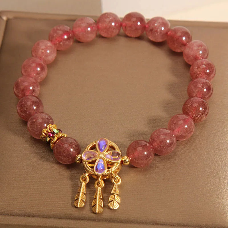 Women's strawberry quartz bracelet with four leaf dream catcher ball pendant