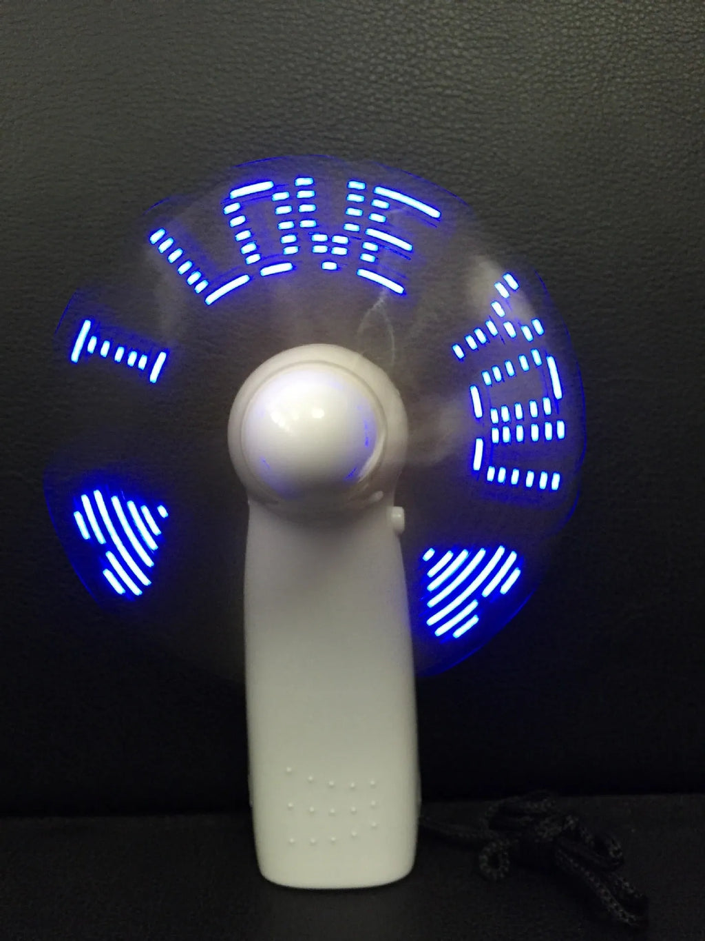 White handheld mini fan with flashing LED I Love You pattern in blue and red colours