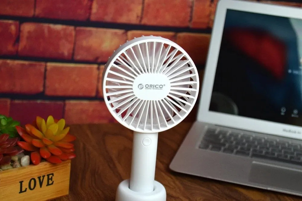 White portable USB desk fan with rechargeable battery, showing three-speed controls and compact design