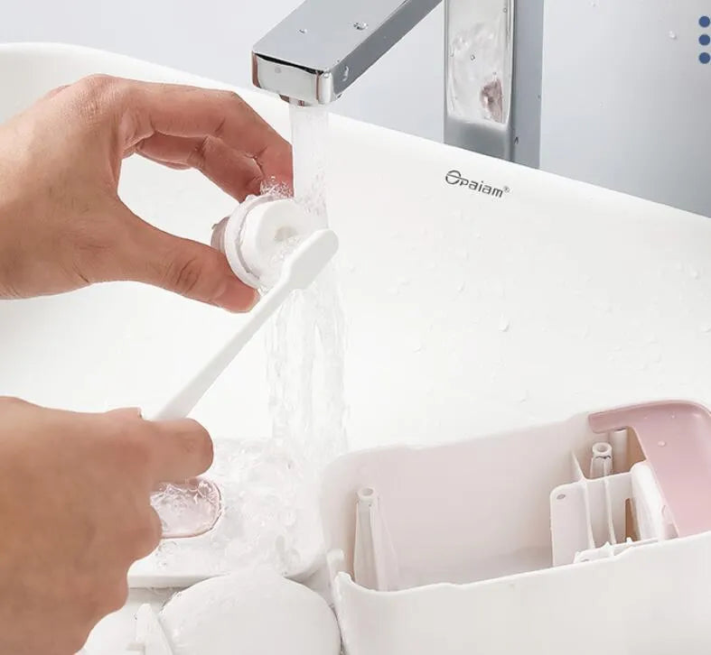 Wall-mounted automatic toothpaste dispenser in blue colour with touch sensor.