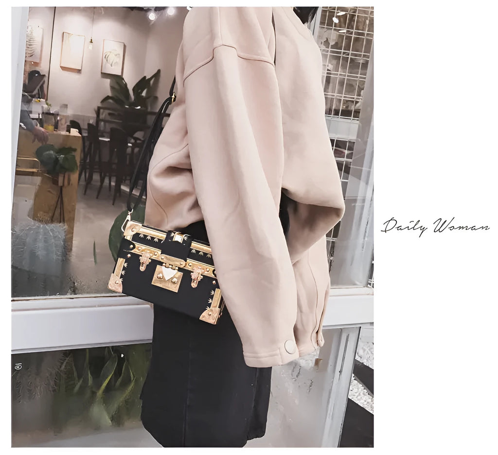 Women's structured shoulder bag with flap closure and adjustable crossbody strap in black or green