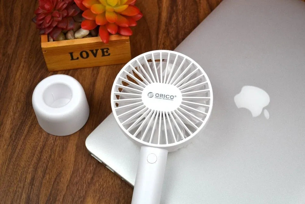 White portable USB desk fan with rechargeable battery, showing three-speed controls and compact design