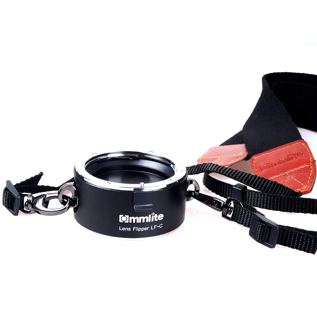 Aluminium camera lens flipper holder for Nikon with cotton shoulder strap.