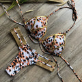 Women's bronzing bikini swimsuit with removable pads and cotton lined cups on a mannequin.