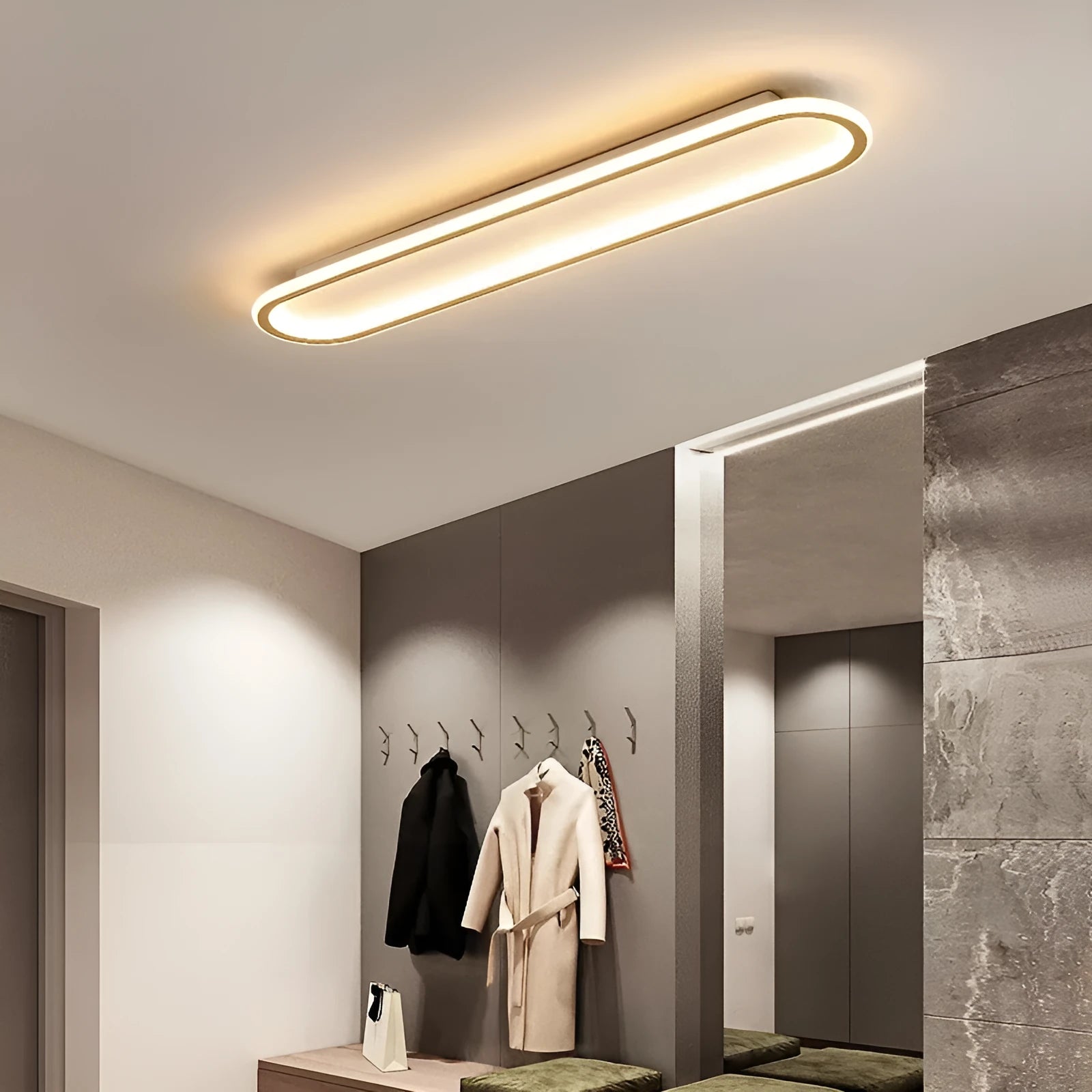 Slim aluminium strip ceiling lamp with PVC diffuser in a minimalist design for corridor or bedroom lighting.