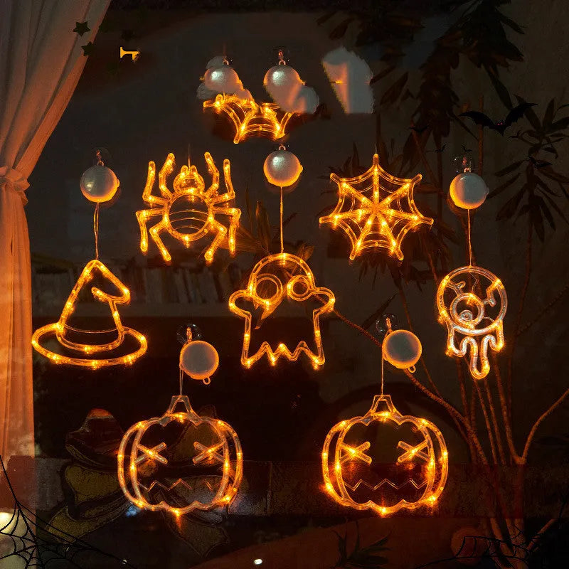 Seven Halloween-themed LED hanging lights with suction cups including spiders, pumpkins and ghosts