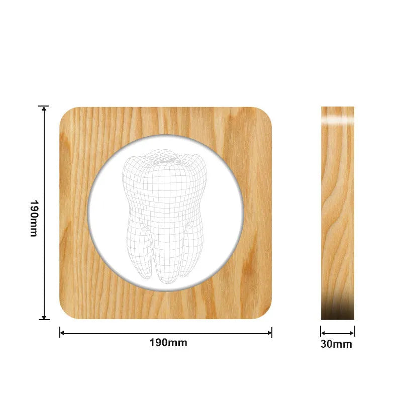 Tooth shaped wooden colour acrylic night lamp with USB cable on a table