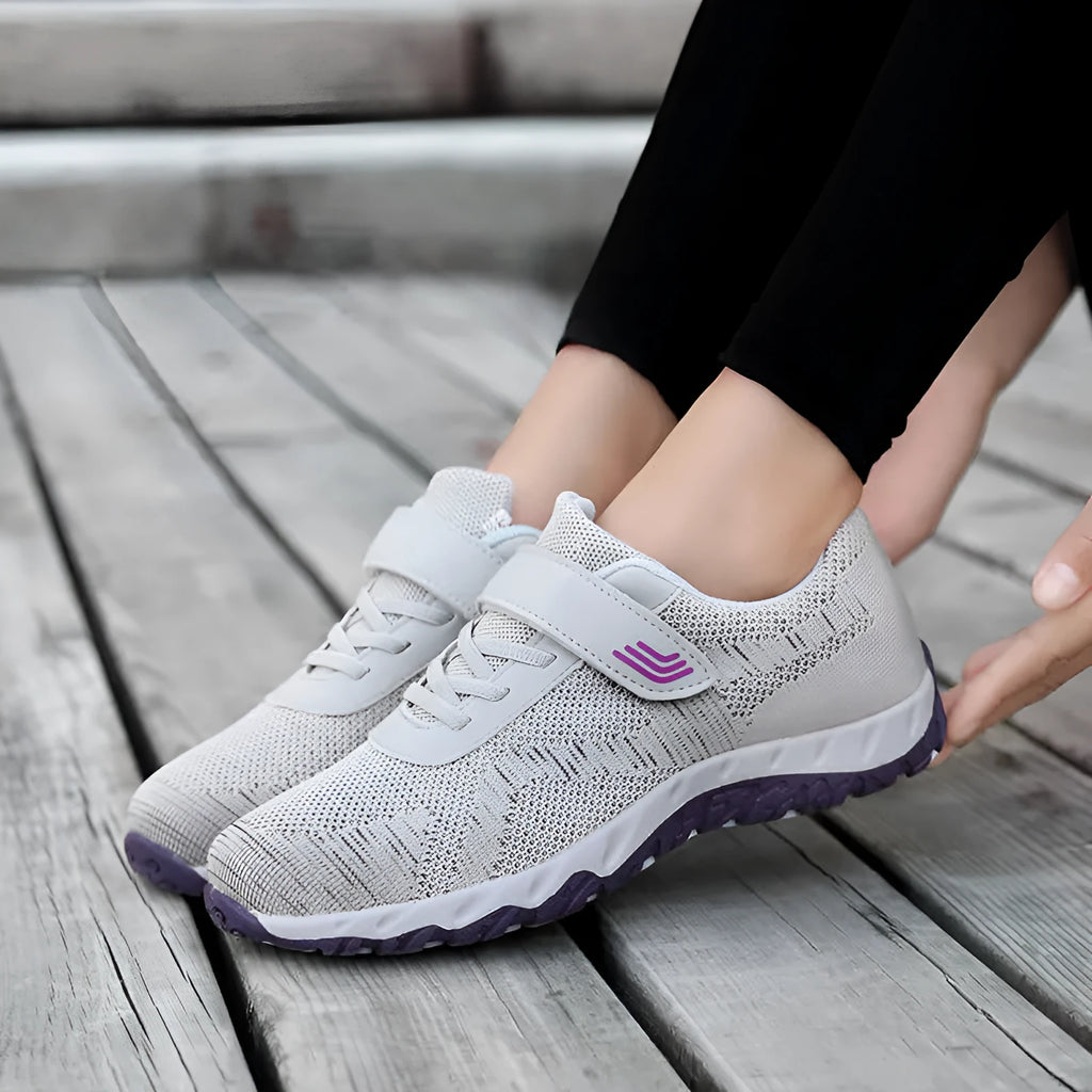 Women's low-top wedge heel shoes with mesh upper and Velcro strap in a solid colour.