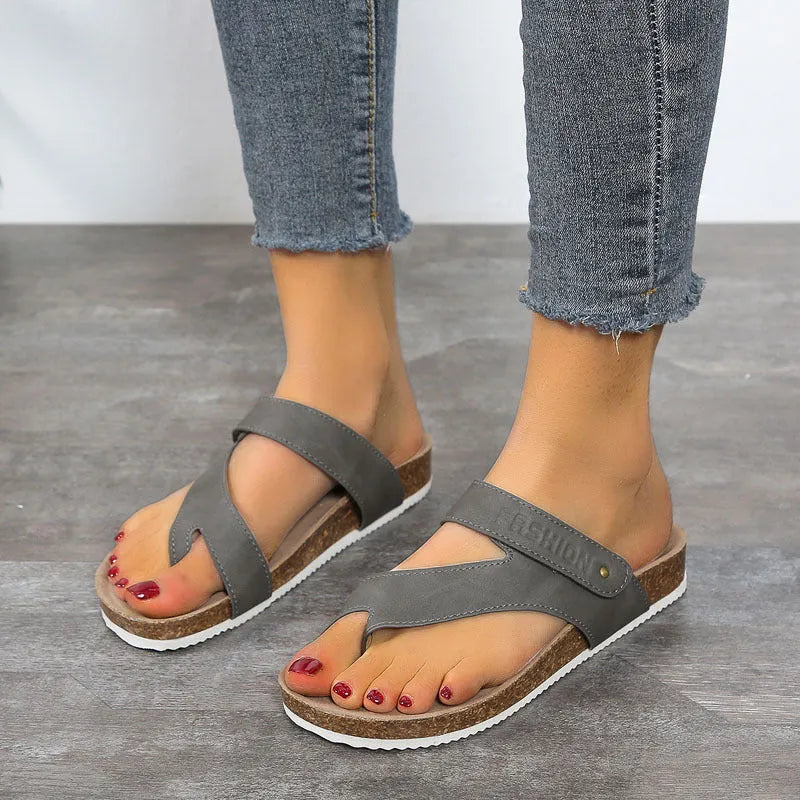 Women's flat toe ring flip-flop in a solid colour with a thick foam sole.