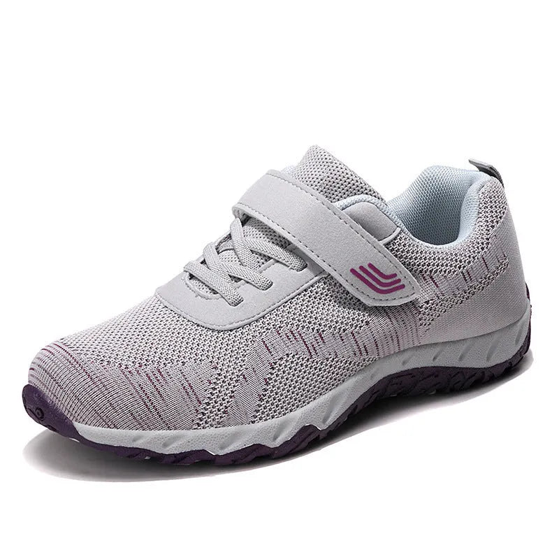 Women's low-top wedge heel shoes with mesh upper and Velcro strap in a solid colour.