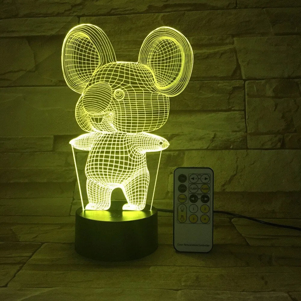 Black koala-shaped LED night light on a table showing multi-colour glow option.