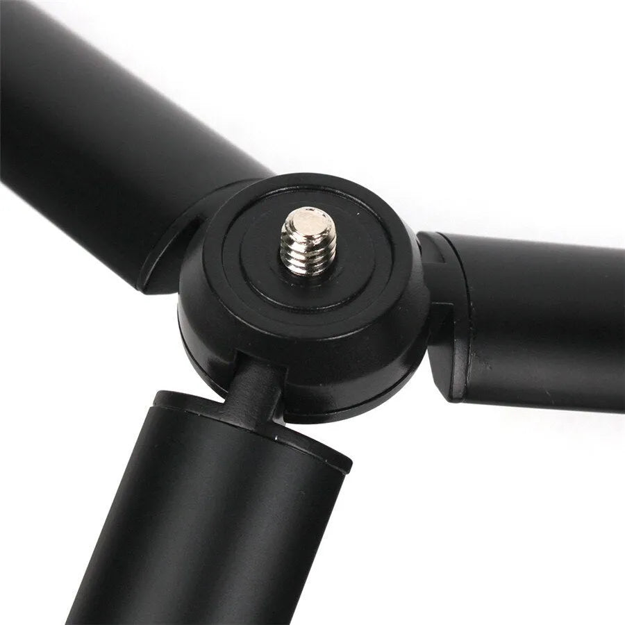 Black aluminium mobile phone tripod with handheld stabilizer grip for smartphone photography