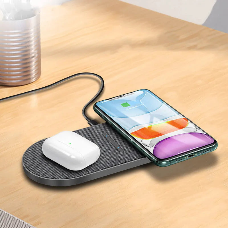 Black dual wireless charging station showing two smartphone charging pads with indicator lights