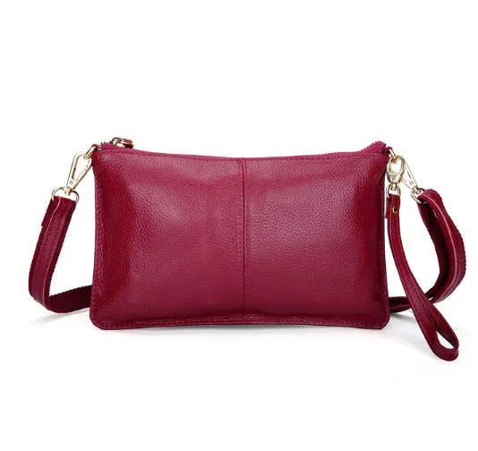 Structured cowhide leather lady slant bag showing front zipper compartment and dual strap options