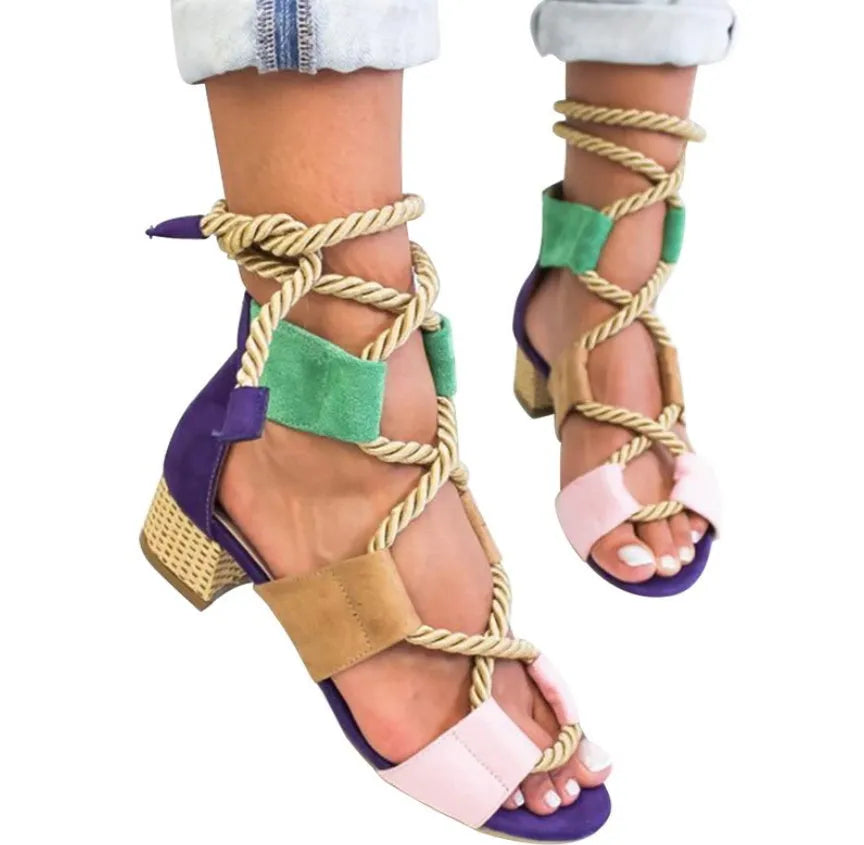 Women's beige suede sandals with a chunky heel, colour-block panels, and an ankle strap.