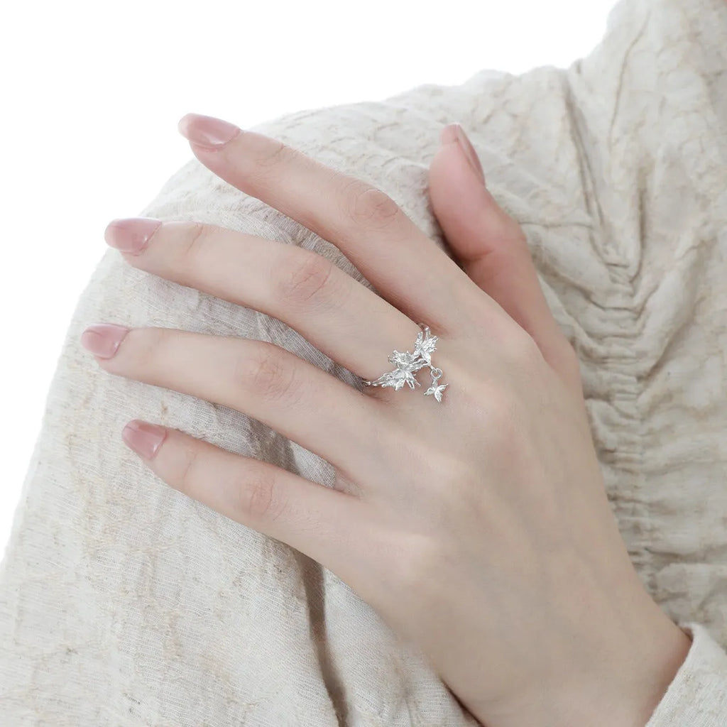 Adjustable silver butterfly ring with white gold or 18K gold electroplating, showing insect motif and open band design