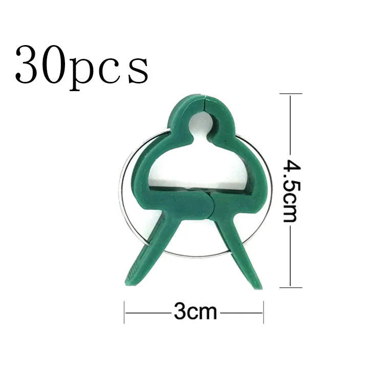 Green plastic and zinc plant fixing clips, large and small sizes, for training climbing vines and tomatoes.
