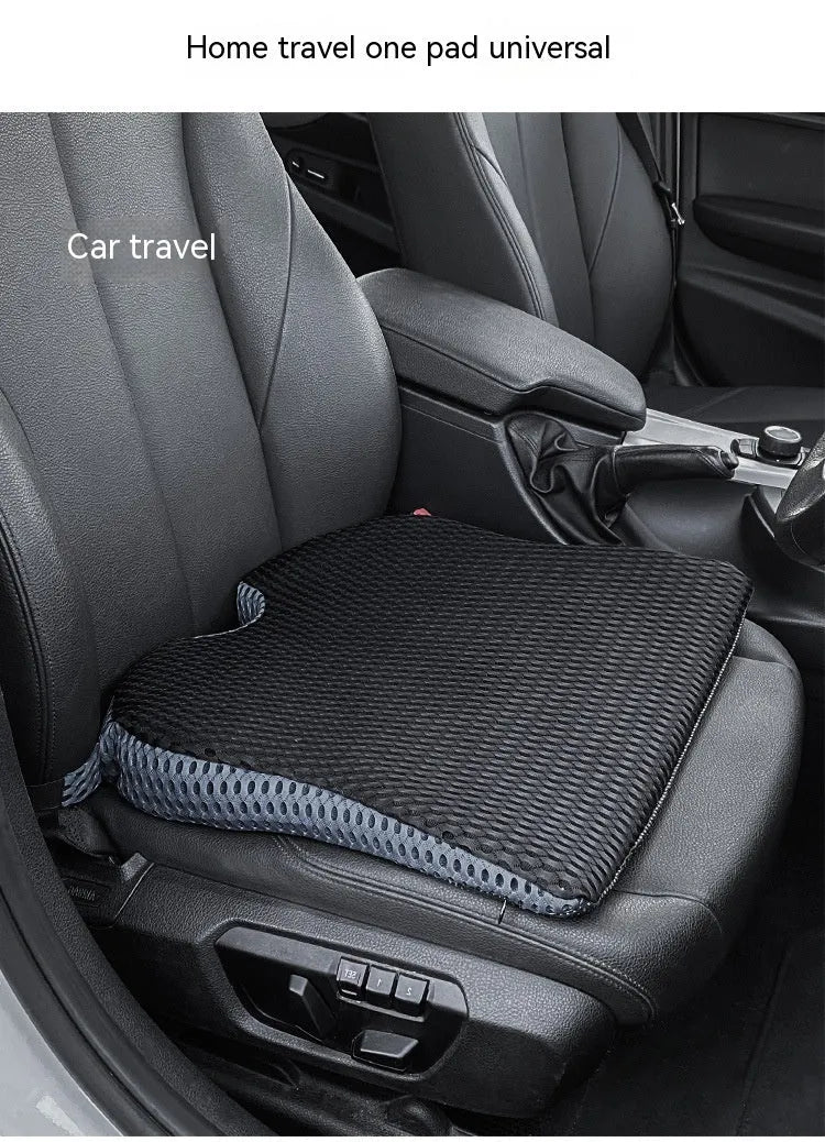 Memory foam seat cushion in grey with elastic strap on a car seat
