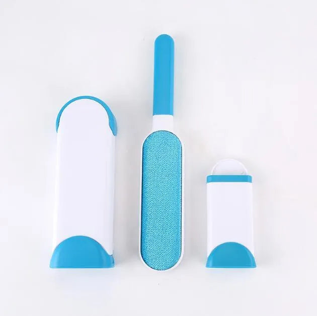 Blue reusable pet hair removal comb with double-sided brush head next to its self-cleaning base.