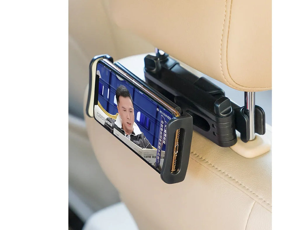 Black car phone holder mounted on rear seat headrest with tablet securely positioned