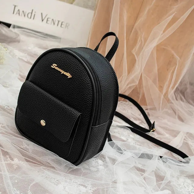 Solid colour PU leather women's small shoulder backpack with zipper, shown in available colours.