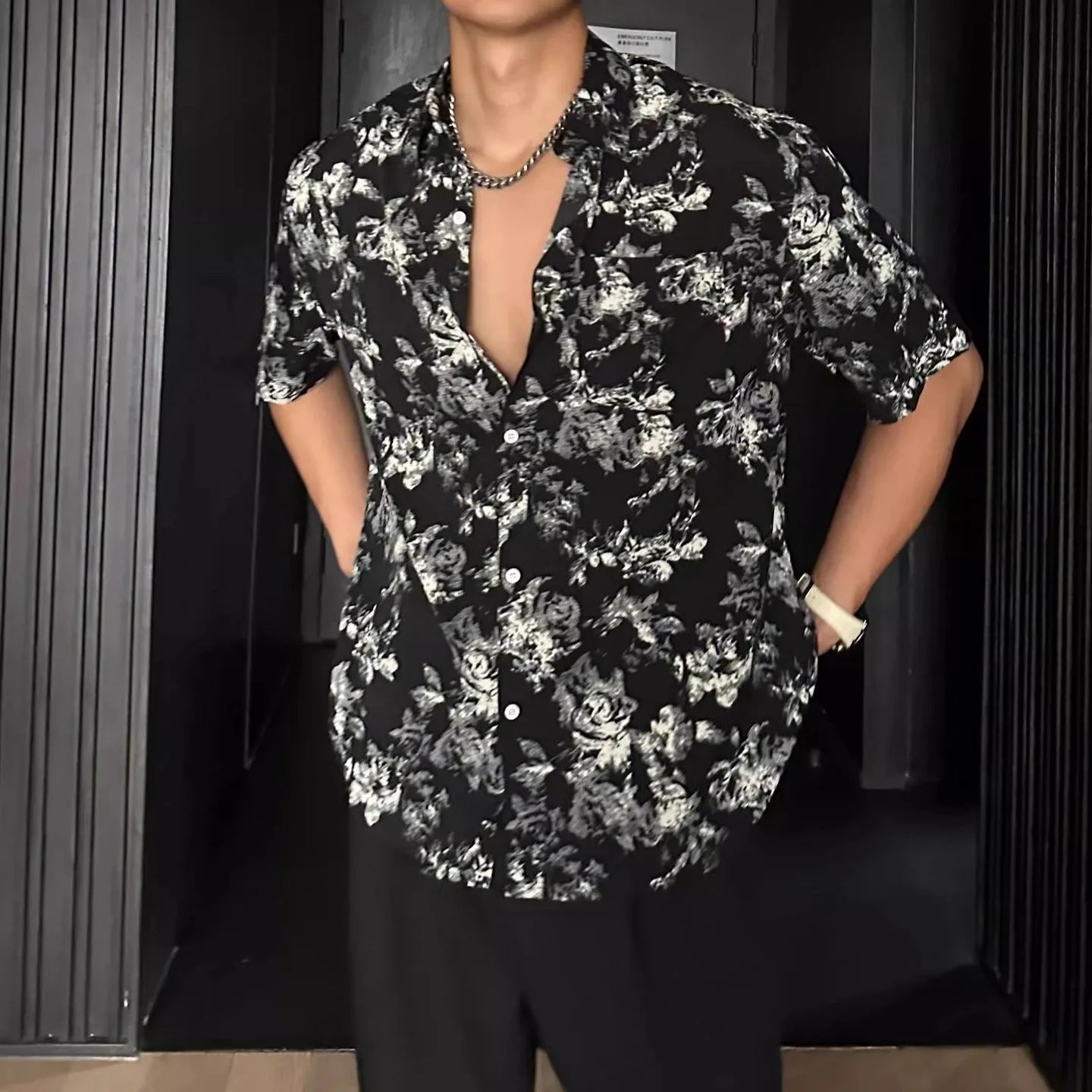 Floral printed short sleeve shirt in loose casual pendant style shown in white and black options