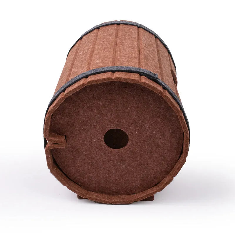 Assembled wine barrel shaped cat bed made from grey polyester fibre felt.